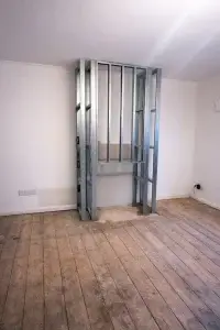 Fake chimney breast log burner installation – custom false fireplace with twin wall flue in Surrey Sussex home by Surrey & Sussex Stoves