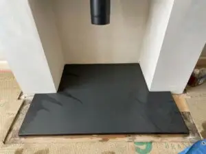 Fireplace hearth regulations UK 2026: non-combustible hearth size & projection for wood burning stove – Surrey & Sussex Stoves guide