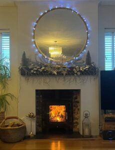 Completed ECOSY Hampton XL log burner installation with rebuilt fireplace, oak beam and slate hearth in Hove, West Sussex