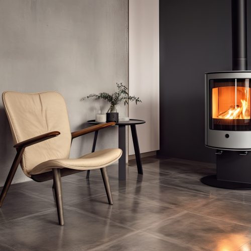 Cozy living room with modern fireplace and panoramic window with great view on the snowy mountains. Concept of rest in houses or cabins on nature. Solitude in nature and escape from everyday life